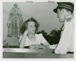 Fashion, World of - Models - Model with guard in front of George Washington statue