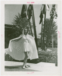 Fashion, World of - Models - Bathing Suits - Model In front of flags