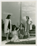 Fashion, World of - Models - Bathing Suits - Group at Court of Communication Fountain with Trylon and Perisphere in background