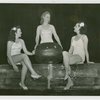 Fashion, World of - Models - Bathing Suits - Models sitting on wall