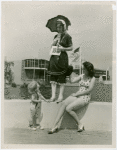 Fashion, World of - Models - Bathing Suits - Models and child in front of pool