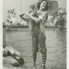 Fashion, World of - Models - Bathing Suits - Model on rock in front of water