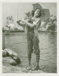 Fashion, World of - Models - Bathing Suits - Model on rock in front of water