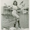 Fashion, World of - Models - Bathing Suits - Model on rock in front of water