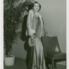 Fashion, World of - Models - Coats - Model with hand on chair