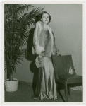 Fashion, World of - Models - Coats - Model with hand on chair