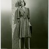 Fashion, World of - Models - Dresses - Model leaning against pole