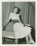 Fashion, World of - Models - Dresses - Model poses on chair