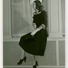 Fashion, World of - Models - Dresses - Model poses by window