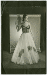 Fashion, World of - Models - Gowns - Model posing with fan