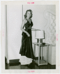 Fashion, World of - Models - Gowns - College fashion model posing by lamp