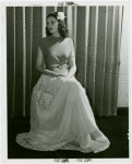 Fashion, World of - Models - Gowns - Model sitting by window