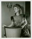 Fashion, World of - Models - Gowns - Model sitting on chair