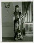 Fashion, World of - Models - Gowns - Model standing by window