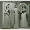 Fashion, World of - Models - Gowns - Three models standing by birdcage