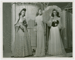 Fashion, World of - Models - Gowns - Three models standing by birdcage