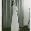 Fashion, World of - Models - Gowns - Model standing by window