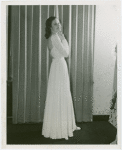 Fashion, World of - Models - Gowns - Model standing by window