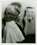 Fashion, World of - Models - Hairstyles - Model looking into mirror