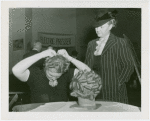 Fashion, World of - Models - Hairstyles - Model fixing hair