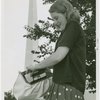 Fashion, World of - Models - Sport - Model putting box into purse