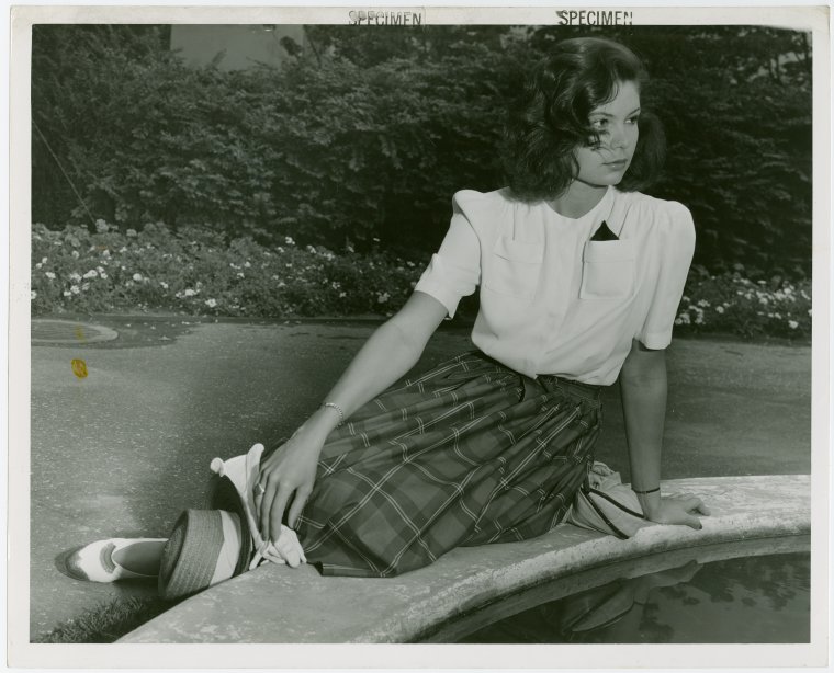 Fashion, World of - Models - Sport - Model sitting on pool edge