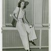 Fashion, World of - Models - Suits - Model sitting in front of window