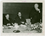 Federal (United States Government) Exhibit - Grover Whalen, Sam D. McReynolds and Henry A. Wallace (U.S. Secretary of Agriculture) at luncheon