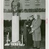 Federal (United States Government) Exhibit - Officials look at bust
