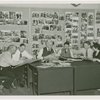 Federal Housing Administration - Harvey Gibson and group in office with Typical American Family pictures
