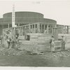 Federal Housing Administration - Houses - Construction - Men building house in front of Contemporary Art Building