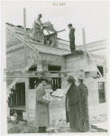 Federal Housing Administration - Houses - Construction - Men building house while group looks on