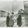 Federal Housing Administration - Houses - Construction - Group looks at paper at construction site
