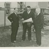 Federal Housing Administration - Houses - Construction - Group looks at plan at construction site