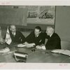 Finland Participation - Harry Roneholm (Finland Commissioner), K.F. Altio and William Standley sign contract