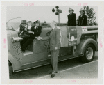 Firemen - Group on fire engine