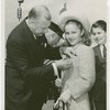 Firemen - Fire Department of New York - Fire Commissioner pins medal on girl