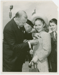 Firemen - Fire Department of New York - Fire Commissioner pins medal on girl