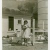 Firestone - Building - Farm - Woman coming out of chicken coop