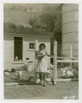 Firestone - Building - Farm - Woman coming out of chicken coop