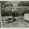 Firestone - Building - Farm - Man pushing wheelbarrow