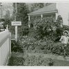 Firestone - Building - Farm - Boy watching woman plant flowers