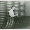 Firestone - Exhibits - Man inspecting tires