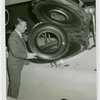 Firestone - Firestone Brothers - Inspecting synthetic rubber tire