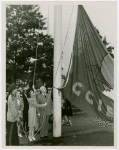 Flags - Miss Treasure Island with Harvey Gibson raising San Francisco's Golden Gate International Exposition flag
