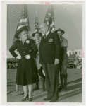 Flags - Boy Scouts - Man and woman with boy scouts holding American flags