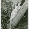 Florida Participation - Woman in bathing suit leaning on palm tree