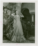Florida Participation - Woman in evening dress leaning on palm tree