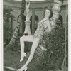 Florida Participation - Woman in bathing suit leaning on palm tree