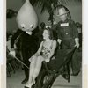 Florida Participation - Woman sitting in wheelchair pushed by Silas Sod as Pete Roleum oils the wheels